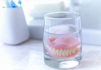 Dentures in a glass of liquid